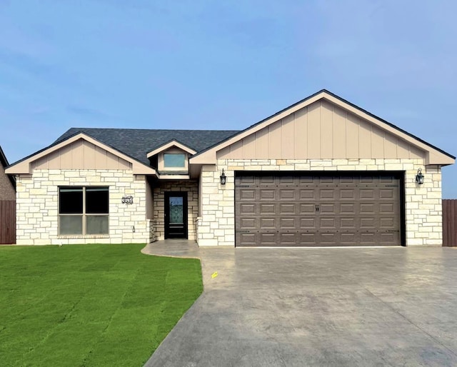 single story home featuring a front yard, roof with shingles, driveway, and an attached garage