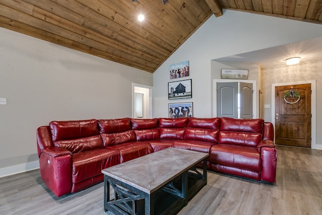 living room featuring hardwood / wood-style flooring, high vaulted ceiling, wooden ceiling, and beam ceiling