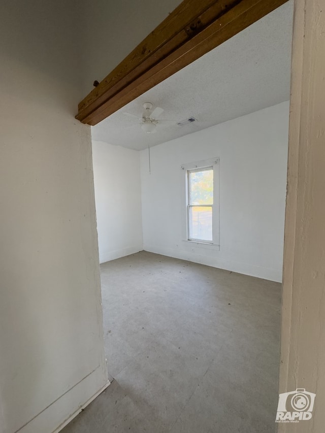 901 S Walnut St, Brady, TX 76825 - empty room featuring unfinished concrete flooring and ceiling fan