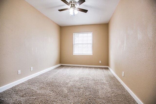 1619 Spaulding St, San Angelo, TX 76905 - carpeted spare room featuring ceiling fan and a textured wall