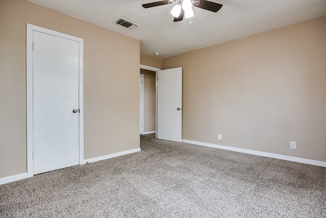 1619 Spaulding St, San Angelo, TX 76905 - unfurnished bedroom featuring carpet floors, a textured ceiling, and ceiling fan