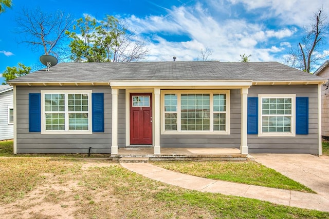1619 Spaulding St, San Angelo, TX 76905 - view of front of property with a front lawn and a shingled roof