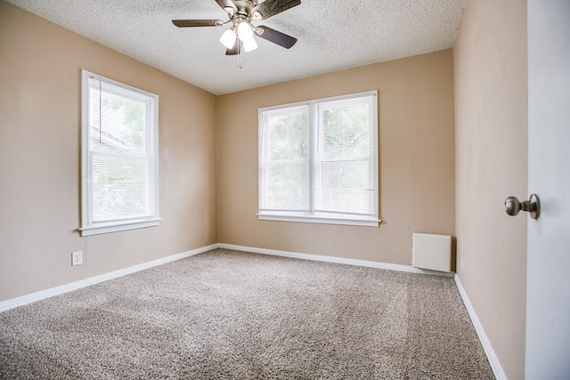 1619 Spaulding St, San Angelo, TX 76905 - unfurnished room with carpet floors, a textured ceiling, and ceiling fan