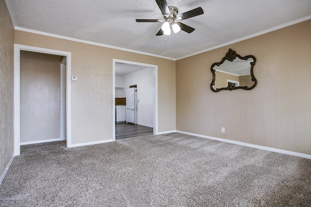 1619 Spaulding St, San Angelo, TX 76905 - empty room featuring carpet floors, a ceiling fan, a textured ceiling, and crown molding
