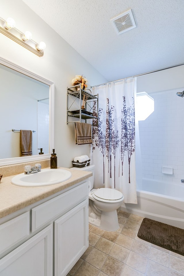 full bathroom featuring a textured ceiling, visible vents, toilet, and vanity
