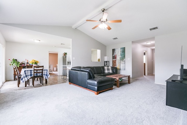 carpeted living room featuring baseboards, visible vents, lofted ceiling with beams, and a ceiling fan