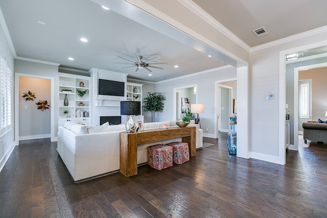 living room with visible vents, baseboards, dark wood finished floors, and a ceiling fan