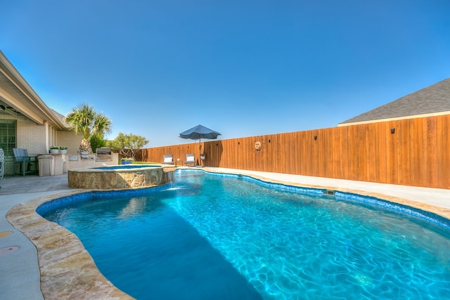 view of pool with area for grilling, a fenced in pool, a patio, and a fenced backyard