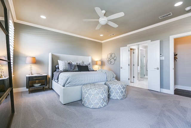 carpeted bedroom with visible vents, baseboards, and crown molding