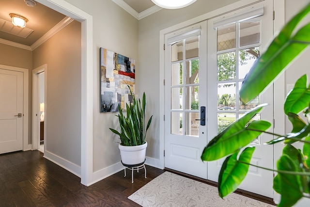 entrance foyer featuring dark wood-style floors, baseboards, and ornamental molding