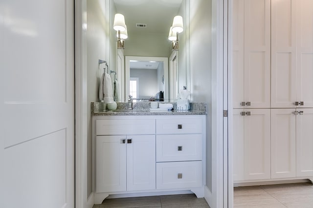 bathroom featuring visible vents and vanity