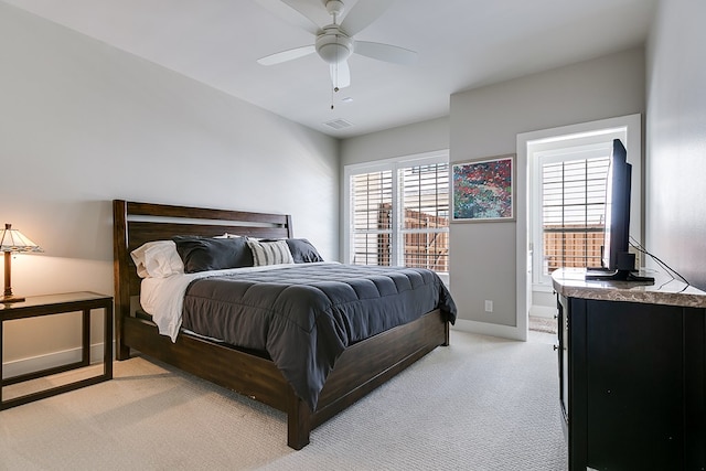 bedroom featuring light carpet, visible vents, ceiling fan, and baseboards