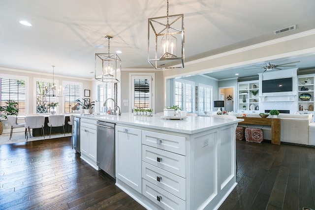 kitchen with white cabinetry, visible vents, dark wood-style flooring, and a sink