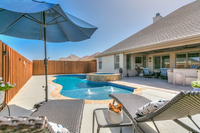 view of swimming pool with a ceiling fan, a fenced backyard, a fenced in pool, an in ground hot tub, and a patio area