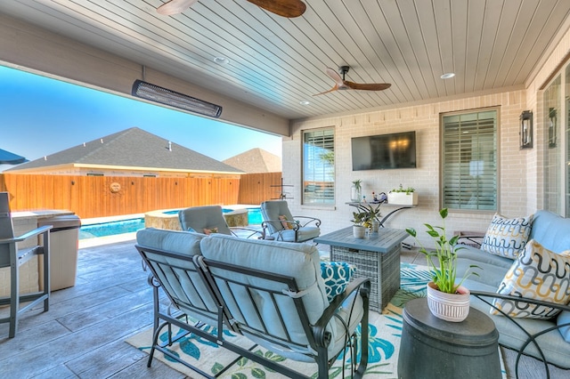 view of patio / terrace featuring fence, a fenced in pool, and an outdoor hangout area