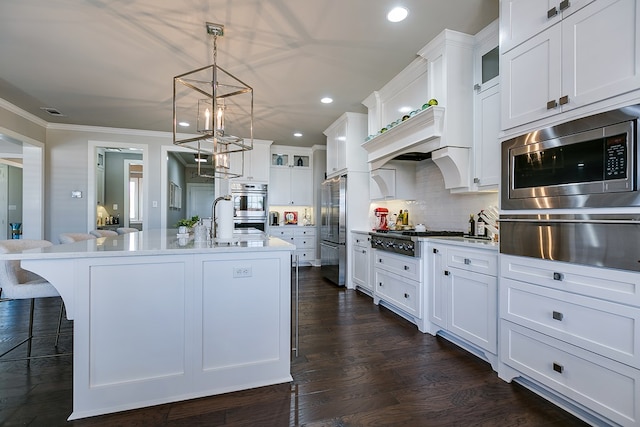 kitchen featuring dark wood-style floors, stainless steel appliances, glass insert cabinets, crown molding, and a warming drawer