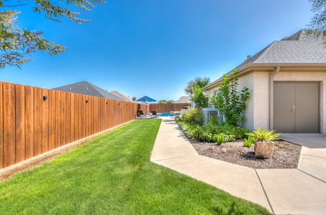 view of yard featuring a patio and a fenced backyard