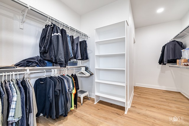 spacious closet featuring hardwood / wood-style floors