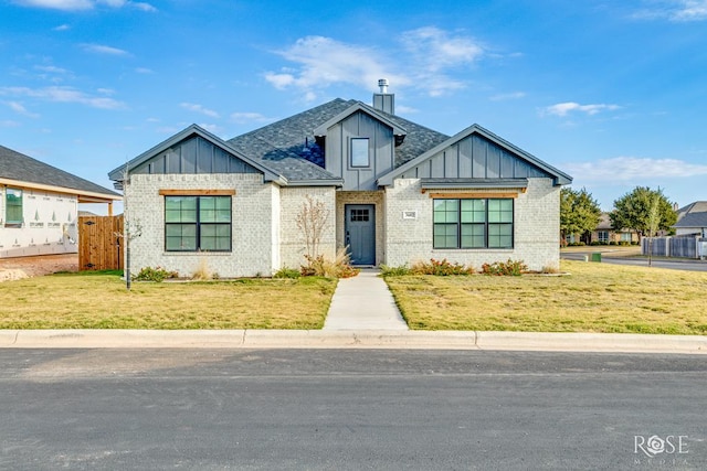 view of front of property with a front lawn