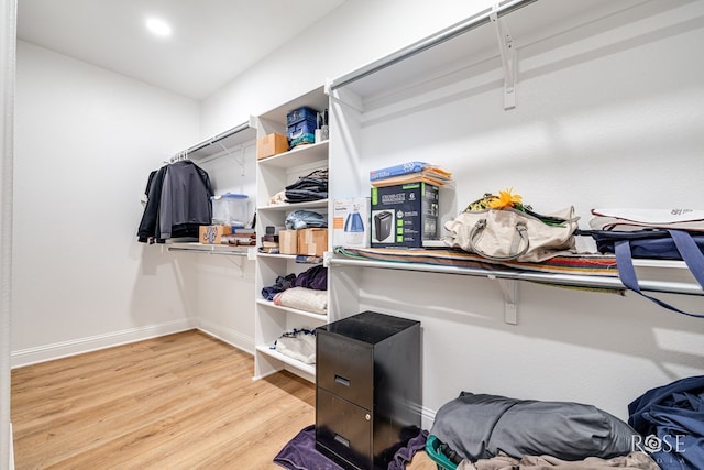 walk in closet featuring light hardwood / wood-style flooring