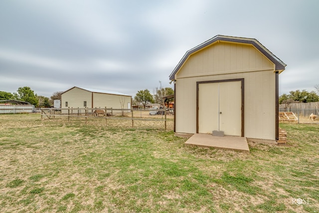 view of shed with a fenced backyard