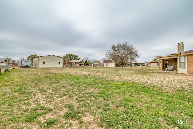 view of yard with a residential view and fence