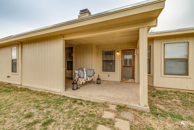 rear view of property featuring a patio area