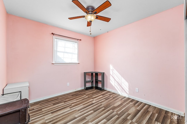 unfurnished room with hardwood / wood-style flooring and ceiling fan