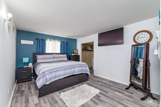 bedroom featuring hardwood / wood-style flooring