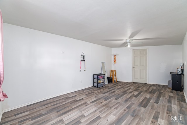 miscellaneous room with dark hardwood / wood-style floors and ceiling fan