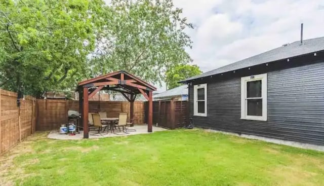 view of yard featuring a gazebo, a fenced backyard, and a patio