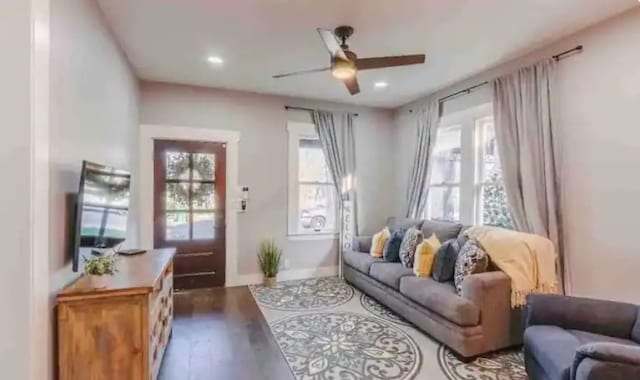 living room featuring recessed lighting, dark wood-type flooring, and ceiling fan