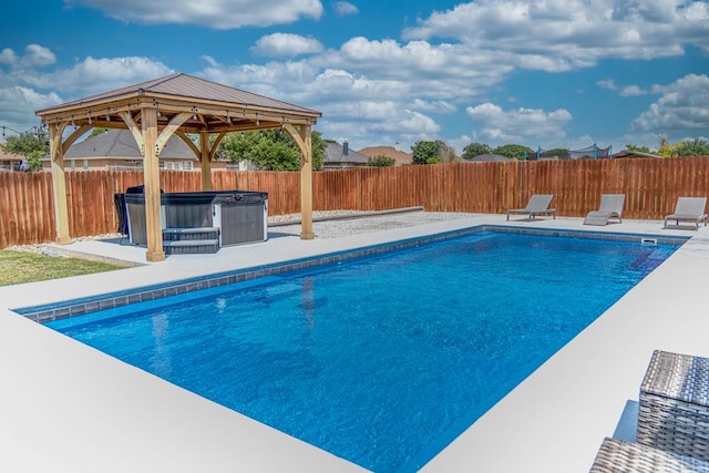 1901 Chesney Ln, San Angelo, TX 76904 - view of swimming pool with a hot tub, a patio area, a fenced backyard, and a gazebo