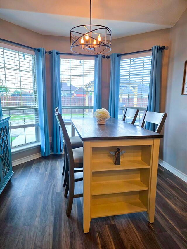 1901 Chesney Ln, San Angelo, TX 76904 - dining space featuring a chandelier, baseboards, and dark wood-style floors
