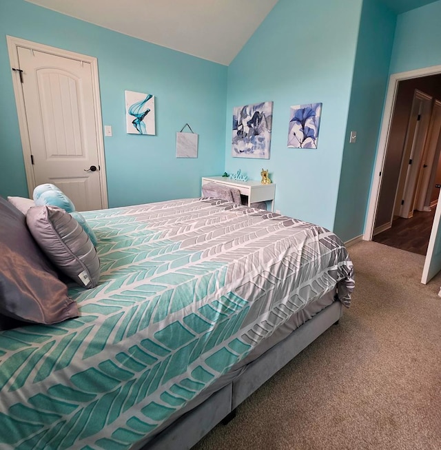 1901 Chesney Ln, San Angelo, TX 76904 - carpeted bedroom with vaulted ceiling and baseboards