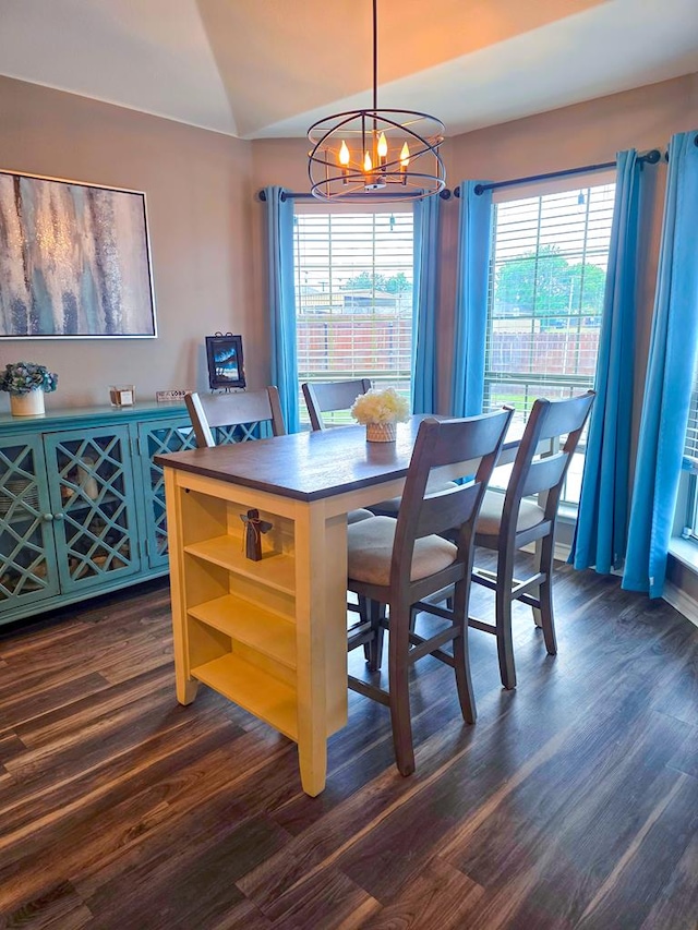 1901 Chesney Ln, San Angelo, TX 76904 - dining room featuring a chandelier, dark wood-type flooring, and vaulted ceiling