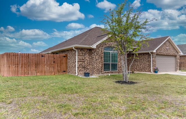 1901 Chesney Ln, San Angelo, TX 76904 - view of front facade featuring brick siding, an attached garage, roof with shingles, and driveway