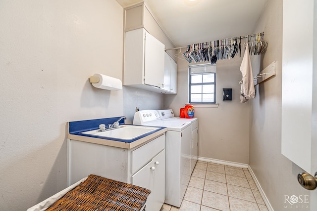 3405 Shadyhill Dr, San Angelo, TX 76904 - washroom featuring cabinet space, washer and clothes dryer, baseboards, and light tile patterned floors