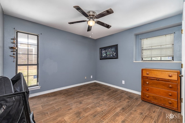 3405 Shadyhill Dr, San Angelo, TX 76904 - unfurnished bedroom featuring wood finished floors, baseboards, and a ceiling fan