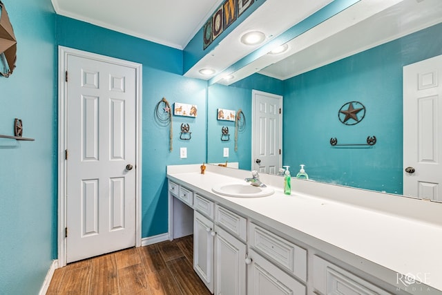 3405 Shadyhill Dr, San Angelo, TX 76904 - bathroom with wood finished floors, vanity, baseboards, and ornamental molding