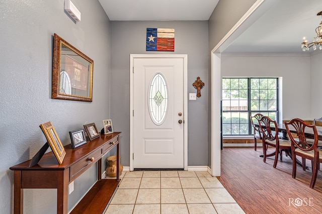 3405 Shadyhill Dr, San Angelo, TX 76904 - entryway with baseboards, a chandelier, and light wood finished floors