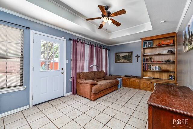3405 Shadyhill Dr, San Angelo, TX 76904 - living area with a tray ceiling, a ceiling fan, light tile patterned floors, ornamental molding, and baseboards