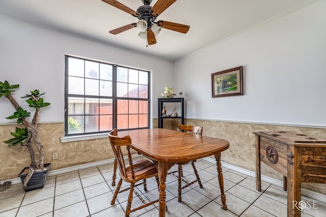 3405 Shadyhill Dr, San Angelo, TX 76904 - dining room with wainscoting, a ceiling fan, light tile patterned floors, healthy amount of natural light, and ornamental molding