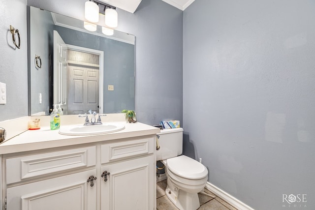 3405 Shadyhill Dr, San Angelo, TX 76904 - bathroom with toilet, vanity, tile patterned floors, and baseboards