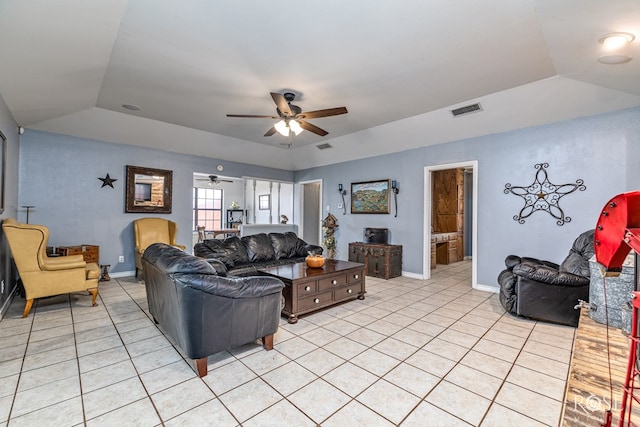 3405 Shadyhill Dr, San Angelo, TX 76904 - living area with light tile patterned flooring, a ceiling fan, a raised ceiling, and baseboards