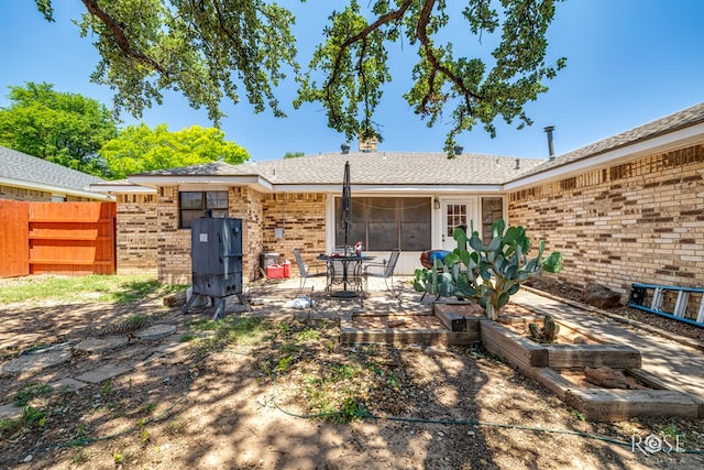 3405 Shadyhill Dr, San Angelo, TX 76904 - rear view of house featuring brick siding and a patio area