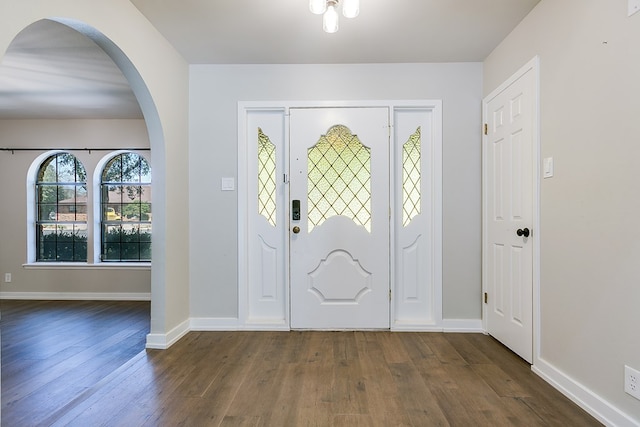 foyer entrance with dark wood-type flooring