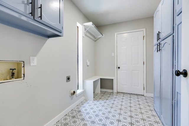 washroom featuring cabinets and electric dryer hookup