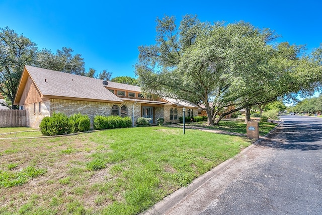 ranch-style house with a front lawn