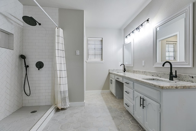 bathroom featuring vanity, a shower with curtain, and tile patterned floors